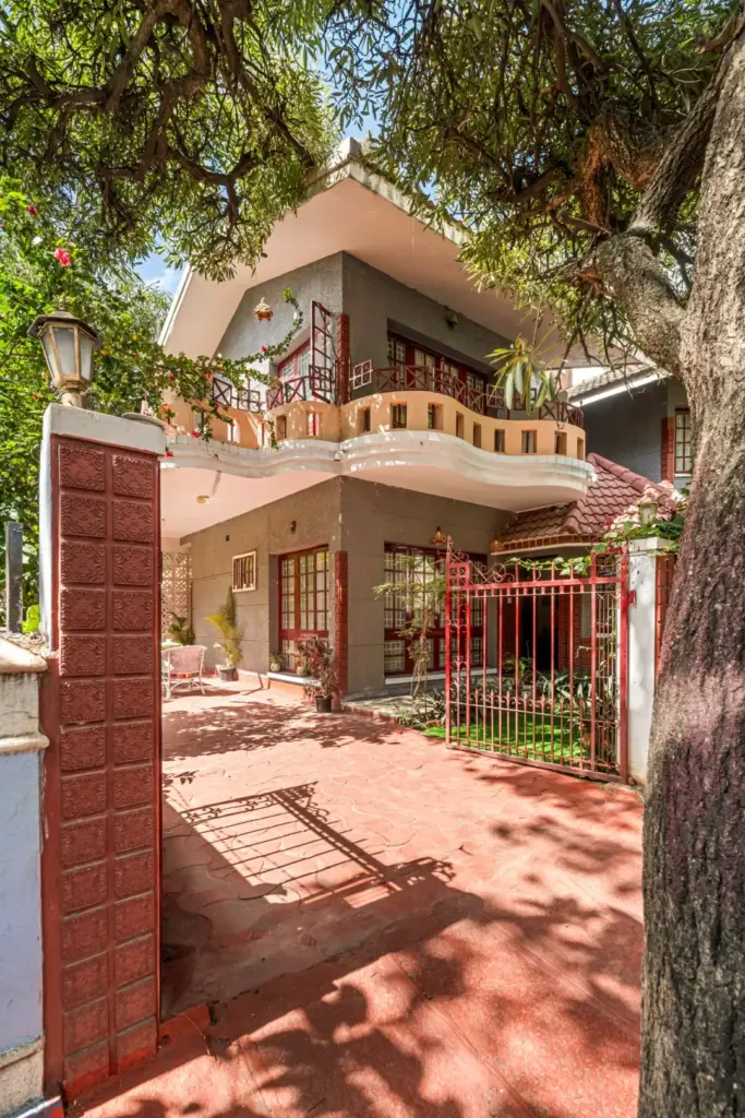 Traditional Rajasthani architecture facade of Heritage Haven Spacez villa in Koramangala Bengaluru surrounded by lush greenery