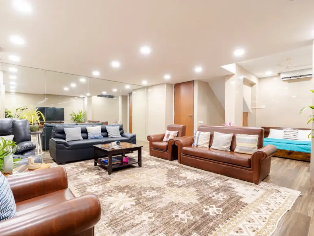 Luxury lounge interior at Hilltop Hideaway villa for premium staycations in Mumbai.