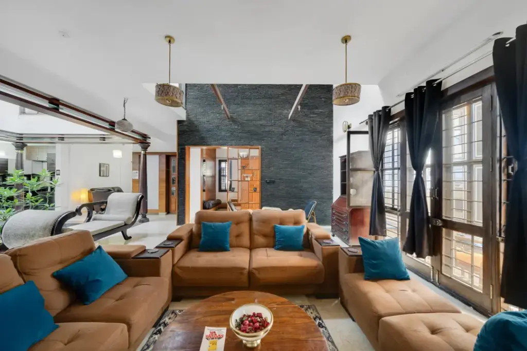 Spacious master bedroom at Lagoon Luxe Spacez with aesthetic interior lighting and view of the private garden