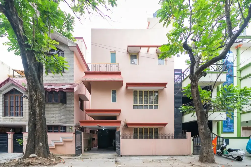 Traditional white-washed Moroccan riad facade of Namma Morocco Spacez with Mediterranean arched windows in Cambridge Layout