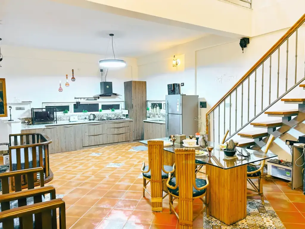 Large open-concept dining hall and gourmet kitchen at Orchid Nirvana for hosting private chef dinners and large family celebrations