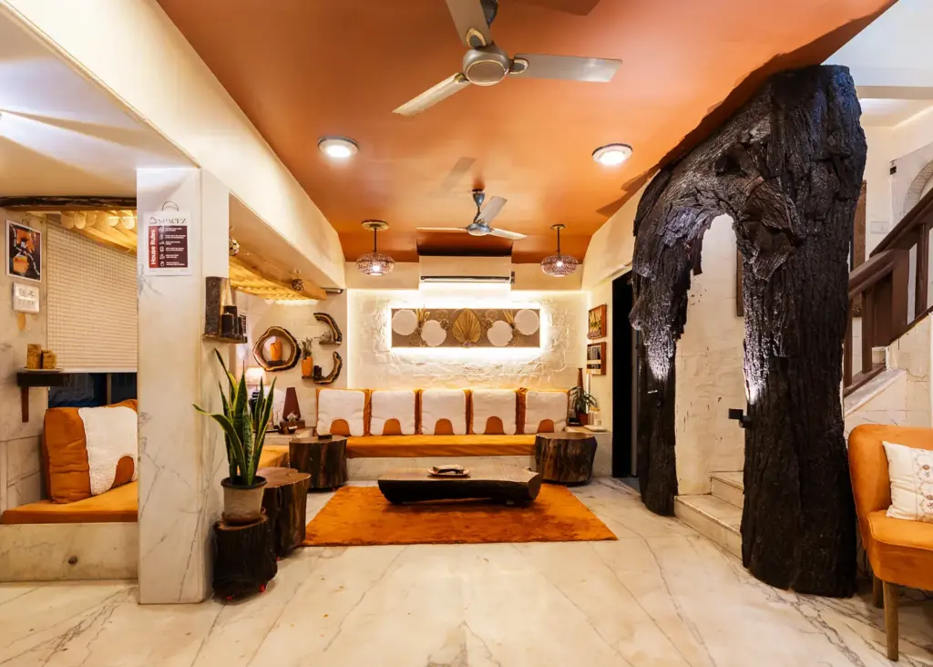 Artistic wooden-themed lounge area at Spacez Soho Nest, Mumbai.