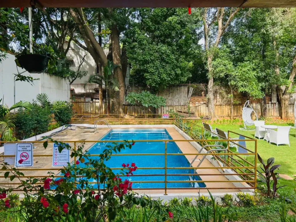 Stunning private swimming pool at a Spacez villa, perfectly lit for a romantic midnight dip and ultimate privacy for couples in Bengaluru.