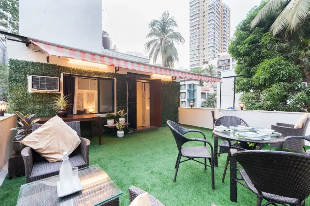 A lush, deep-green private botanical garden at Garden Veil, offering a quiet sanctuary and fresh air escape from Mumbai’s urban hustle.