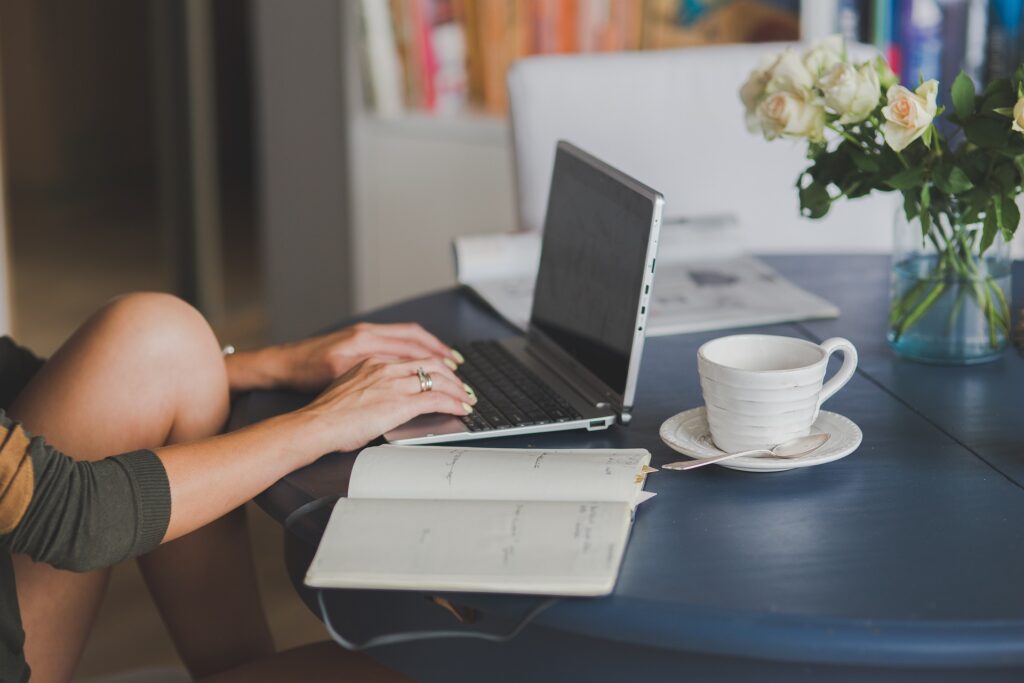 A professional working in a bright, quiet home office, looking focused and calm while attending a video call.
