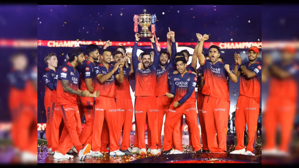 Royal Challengers Bengaluru (RCB) players celebrating with the IPL 2025 trophy at Narendra Modi Stadium, marking their historic first maiden title win after 18 years.