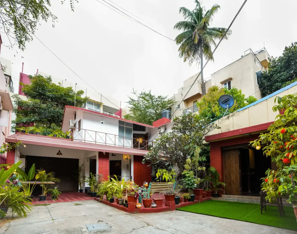 Exterior facade of Cine Castle by Spacez, a luxury 4BHK managed villa in Central Bengaluru featuring a private landscaped garden and modern architectural design, located just minutes from MG Road and Chinnaswamy Stadium.