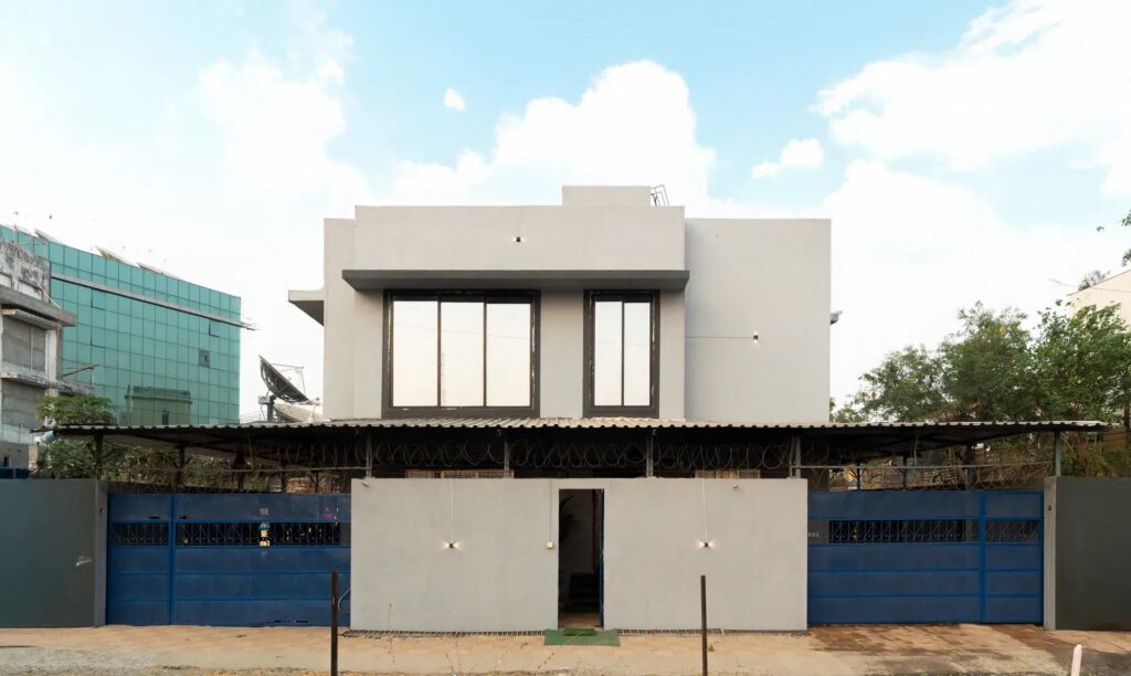 Front entry of Hilltop Hideaway villa in Goregaon with a premium building facade and welcoming entrance.