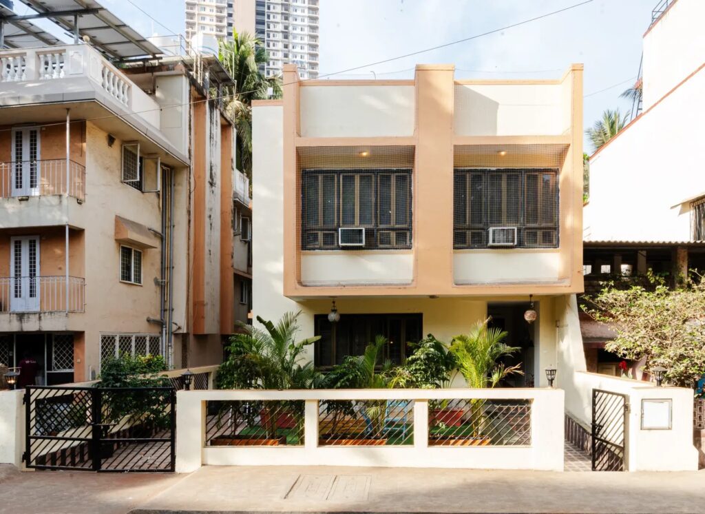 Front building entrance of the Spacez luxury villa with a welcoming, well-lit entryway.